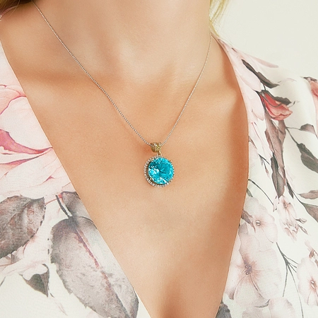 Srebrny okrągły komplet z błękitnym topazem