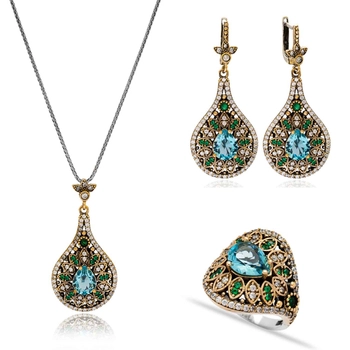 Ażurowy komplet z błękitnym topazem i szmaragdami