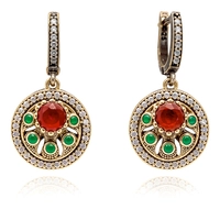 Okrągłe kolczyki srebrne z rubinem